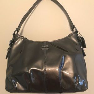 Metallica coach purse and never been used.